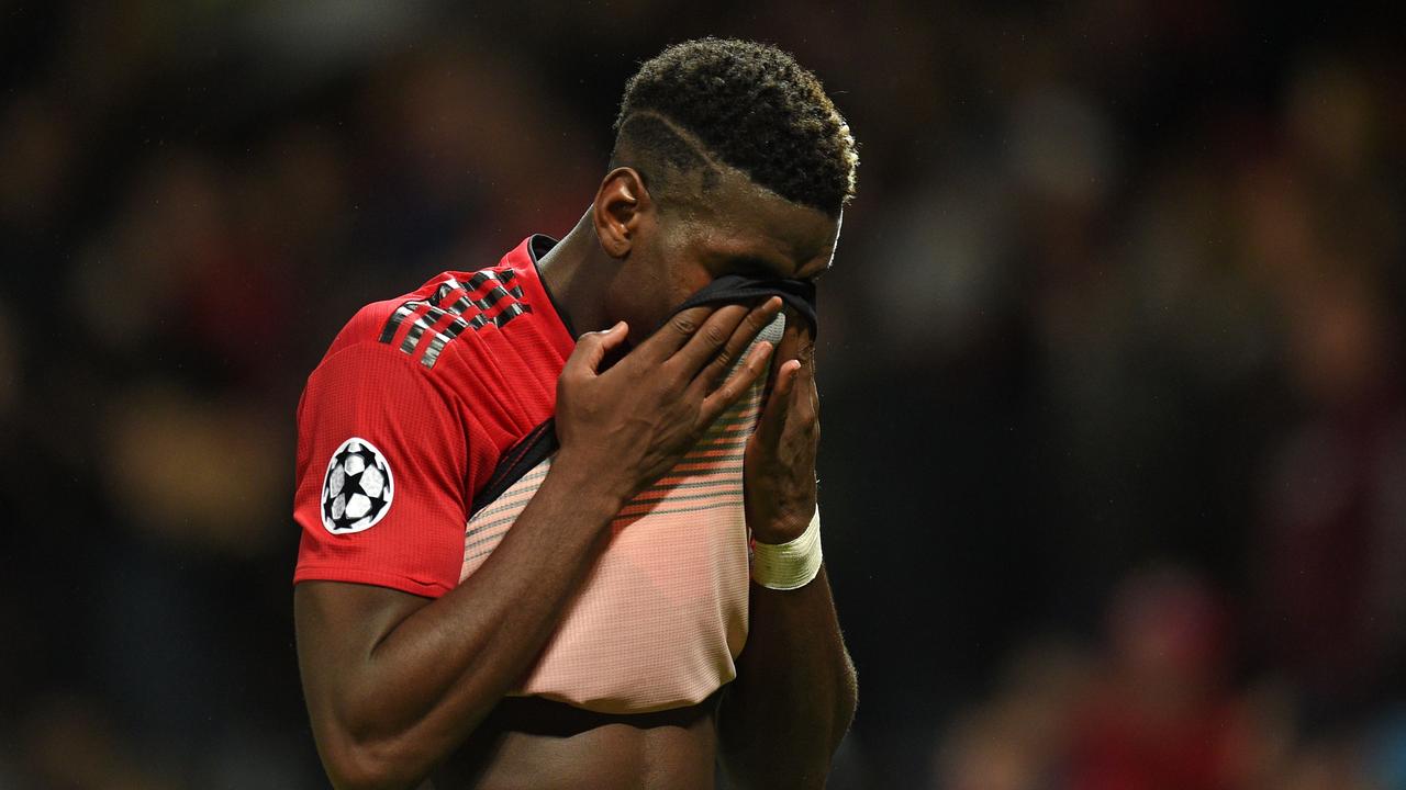 Manchester United's French midfielder Paul Pogba reacts on the pitch after the Champions League group H football match between Manchester United and Juventus at Old Trafford in Manchester, north west England, on October 23, 2018. - Juventus won the game 1-0. (Photo by Oli SCARFF / AFP)