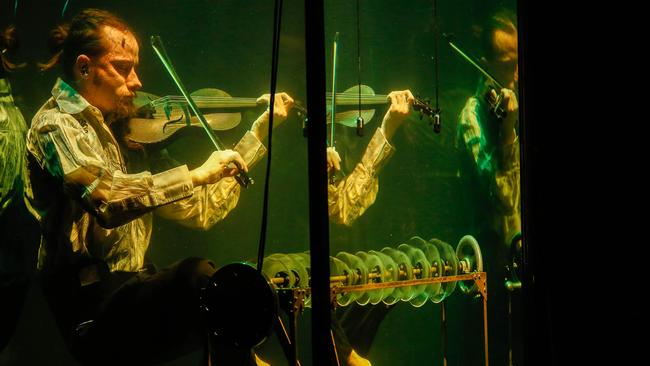 Robert Karlsson playing violin in Between Music’s Aquasonic show. Picture: Glenn Campbell