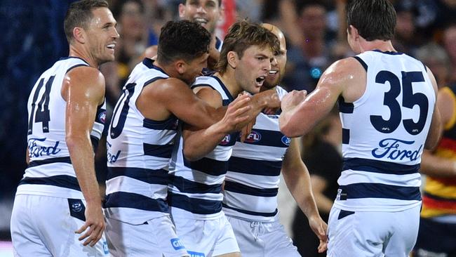 Geelong players celebrate a goal against the Crows. Picture: AAP Images 