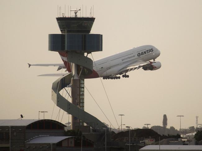 A Qantas Airbus A380 superjumbo takes off past the Air Traffic Control tower at Mascot Airport in Sydney 27/11/2010. The superjumbo took off from Sydney on Saturday on the first A380 passenger flight for the airline since a midair engine explosion earlier this month triggered a global safety review.