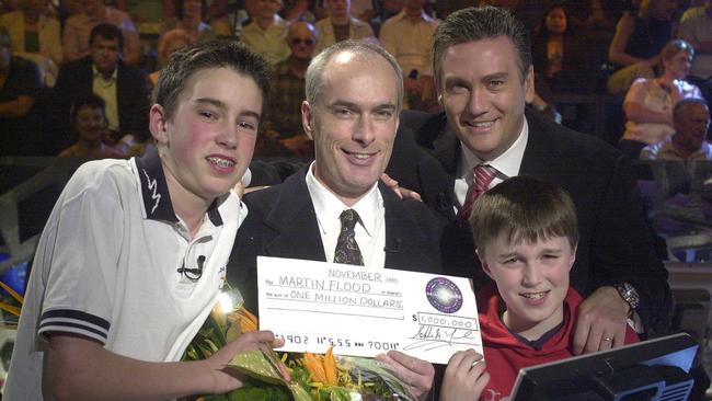 Who Wants To Be A Millionaire winner Martin Flood with his two sons and host Eddie McGuire. From: Channel 9