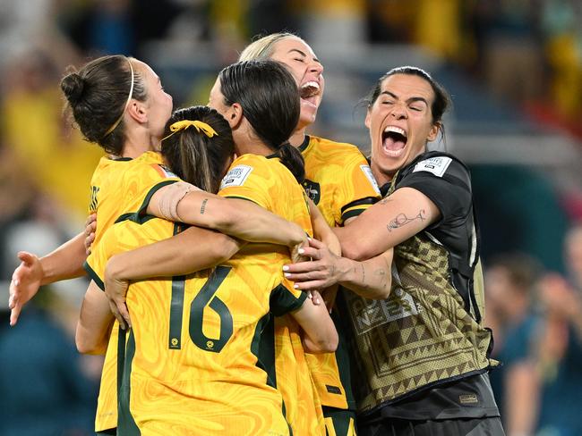 Matildas players go wild after the winning penalty. Picture: Bradley Kanaris/Getty Images.