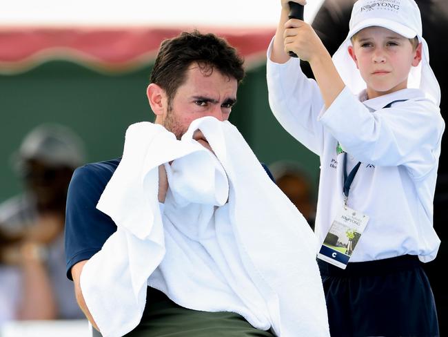 Marin Cilic of Croatia cools down at a change of ends in his match against Kwon Soon-woo of South Korea at the Kooyong Classic tennis tournament in Melbourne on January 15, 2020. (Photo by William WEST / AFP) / --IMAGE RESTRICTED TO EDITORIAL USE - NO COMMERCIAL USE--