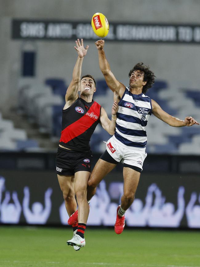 Lawson Humphries (right) spoils the ball away from Jade Gresham during Geelong’s practice match against Essendon. Picture: Michael Klein