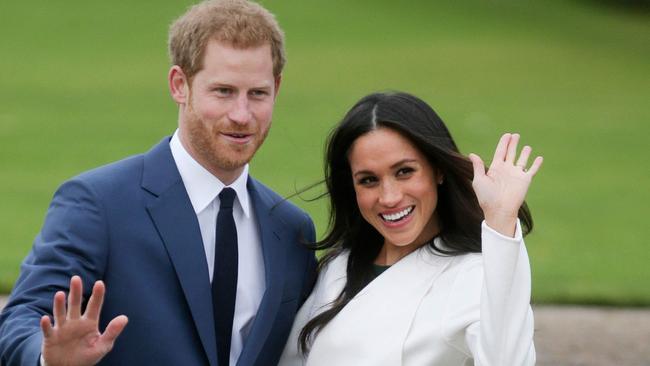 Britain's Prince Harry and his then fiance US actor Meghan Markle pose for a photograph in the Sunken Garden at Kensington Palace in west London on November 27, 2017. Picture: AFP