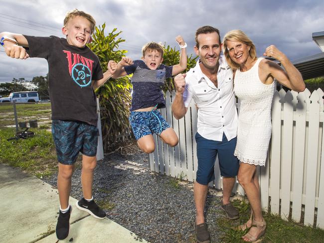 Edwina and Shaun Roberts with their sons Finn, 11, (left) and Ryan, 9 celebrating their court win stopping a petrol company opening a petrol station next to their Mermaid Beach beach shack. Picture: Nigel Hallett