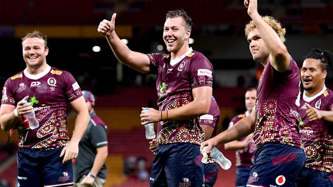 Angus Blyth, Angus Scott-Young and Harry Wilson of the Reds celebrate after Queensland defeated the Brumbies at Suncorp Stadium last weekend. Picture: Getty Images