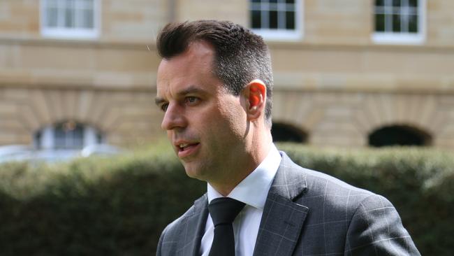 Labor's Josh Willie speaks to the media on parliament Lawns in Hobart.