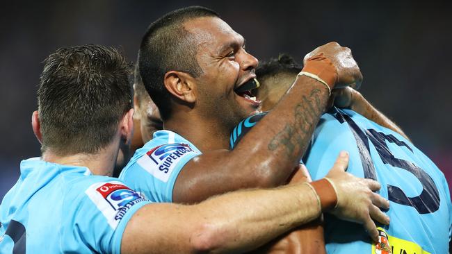 SYDNEY, AUSTRALIA - MARCH 23: Bernard Foley and Kurtley Beale of the Waratahs congratulate Israel Folau of the Waratahs as he celebrates scoring a try during the round six Super Rugby match between the Waratahs and the Crusaders on March 23, 2019 in Sydney, Australia. (Photo by Mark Kolbe/Getty Images)