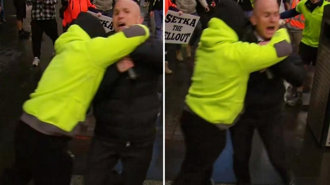 The moment Channel 7 reporter Paul Dowsley was grabbed by a protester at Melbourne's anti-vax rallies. Picture: Channel 7