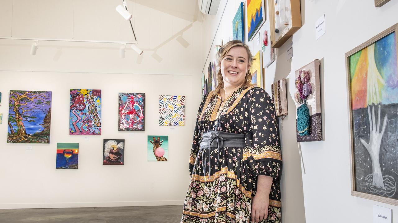 Lighthouse director Bronte Geitz with the Art Therapy exhibition at The Lighthouse Toowoomba. Thursday, June 23, 2022. Picture: Nev Madsen.