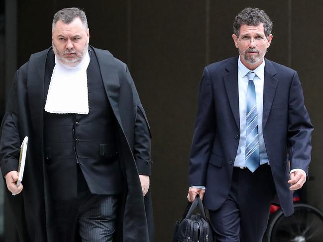 Professor Peter Ridd (right) leaves court with his barrister Stuart Wood QC. Picture: Liam Kidston