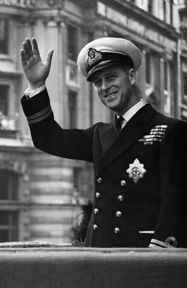 May 1948: Prince Philip, Duke Of Edinburgh waving through the open roof of a car. Picture: Central Press/Getty Images