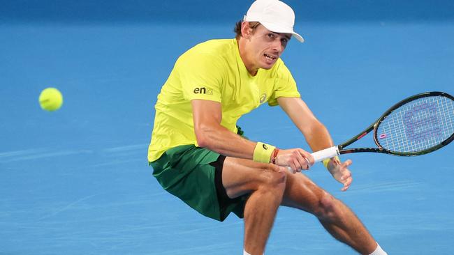 Alex de Minaur hits a return against Cameron Norrie during their United Cup tennis tournament in Sydney. Picture: AFP