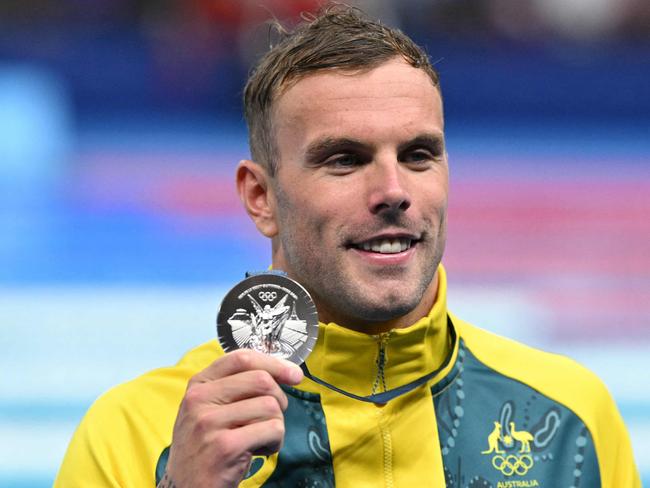 Silver medallist Australia's Kyle Chalmers poses during the podium ceremony of the men's 100m freestyle swimming event during the Paris 2024 Olympic Games at the Paris La Defense Arena in Nanterre, west of Paris, on July 31, 2024. (Photo by Oli SCARFF / AFP)