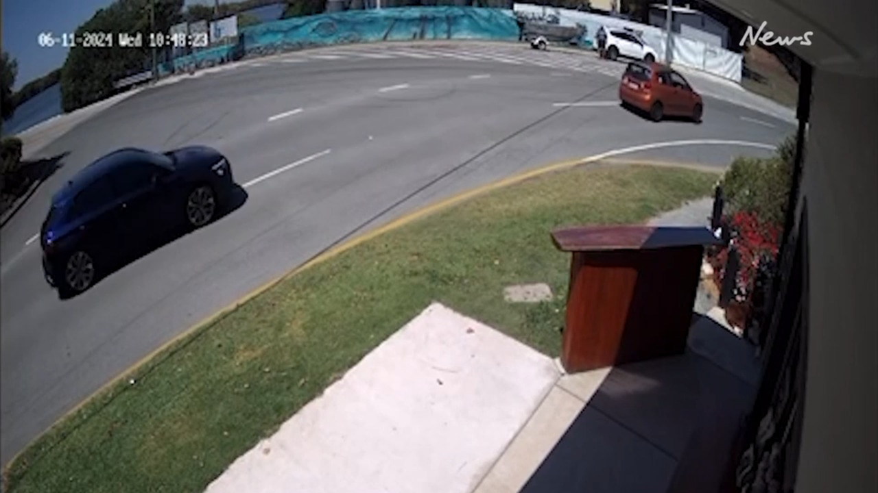 Heart-stopping footage shows the moment the blue Audi is followed by the orange Barina