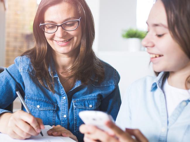 Photo of mother and daughter planning at home