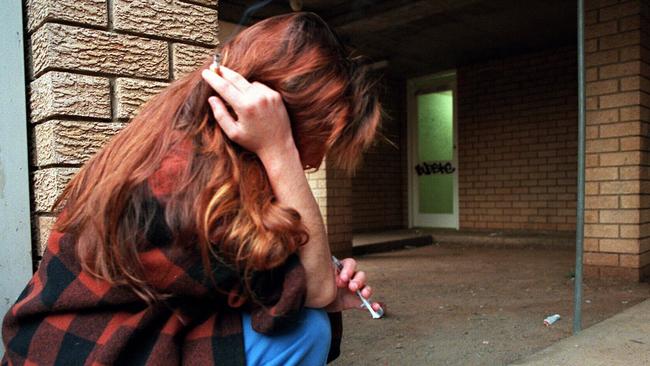 A drug addict was seen shooting up heroin with a syringe behind a block of units in Cabramatta East in May 1997.