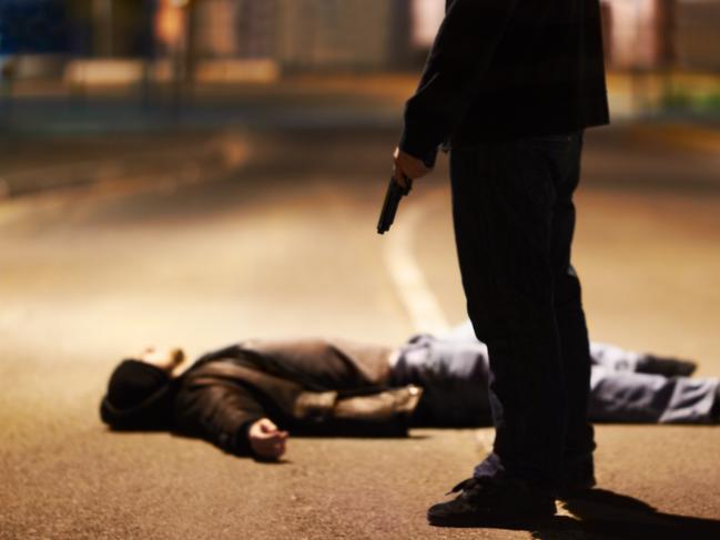 Generic crime Istock  -  Man lying on the ground after being shot by a gun-wielding criminal