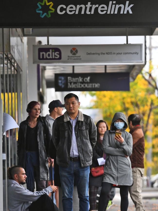 People queue up outside a Centrelink office in Melbourne. Picture: AFP