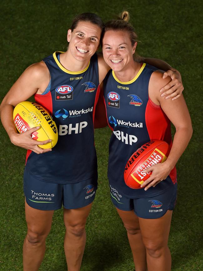 They’ve known each other a long time and have many similar memories of growing up playing grassroots girls footy. Chelsea Randall, left, and Courtney Cramey now play together at the Crows. Photo: Naomi Jellicoe