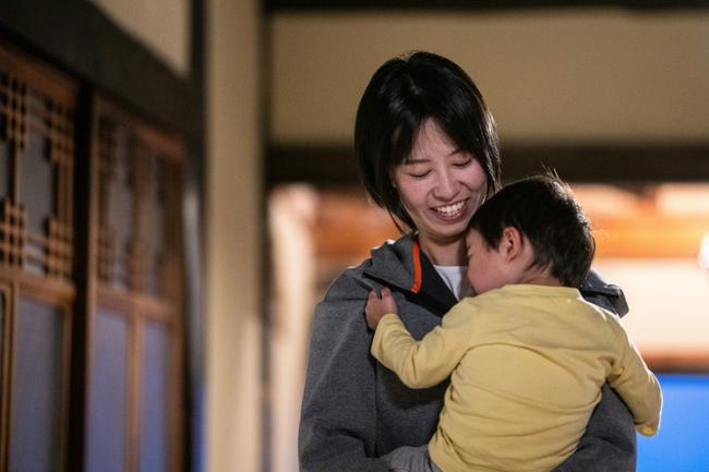 Rie Kato playing with her son Kuranosuke Kato in their house in the village of Ichinono, in the city of Tamba-Sasayama, Hyogo Prefecture