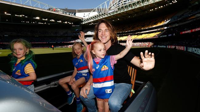 Picken’s lap of honour with his kids after retiring in 2019. Photo by Michael Willson/AFL Photos/Getty Images