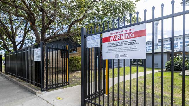 High security fences surround Kedron State High School. Schools have been installing tall, spiked security fences to help curb crime within school grounds after-hours.