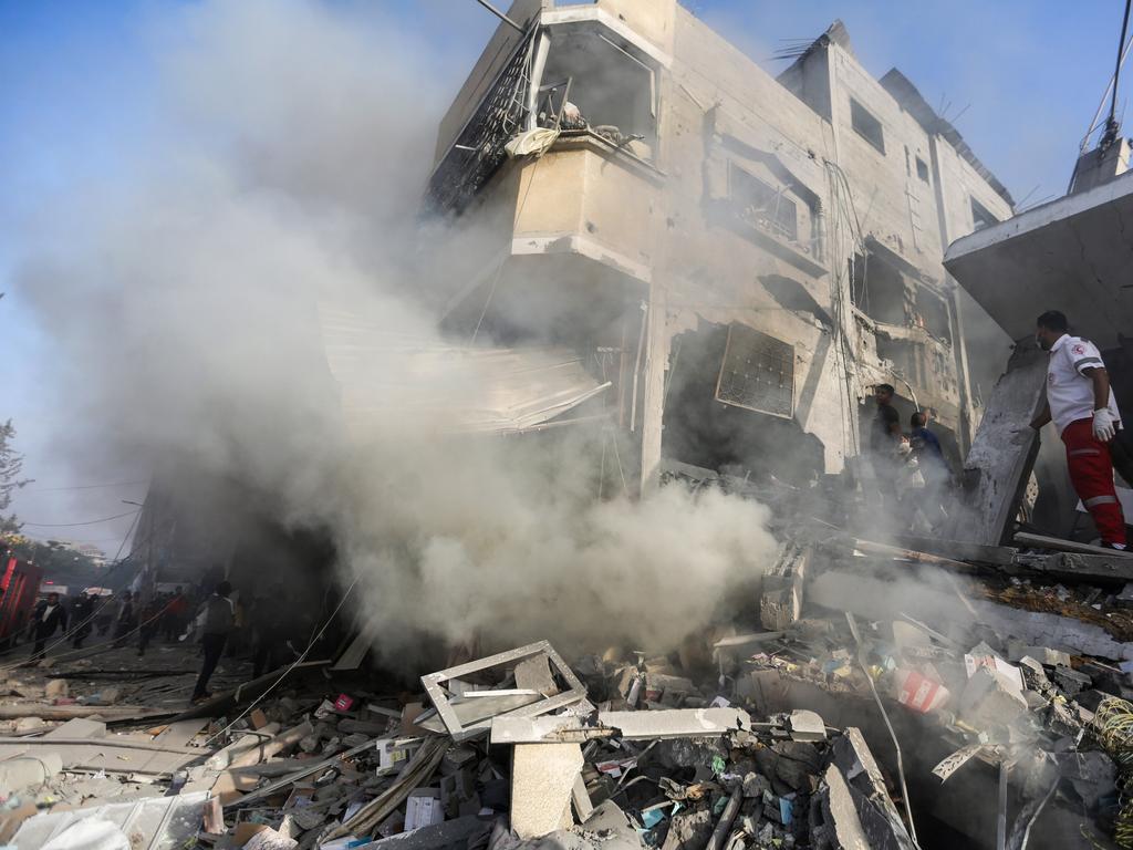 People search through buildings, destroyed during Israeli air raids in the southern Gaza Strip in Khan Yunis, Gaza. Picture: Getty Images