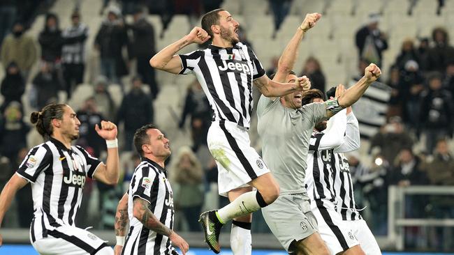 Juventus players celebrate at the end of a Serie A match.