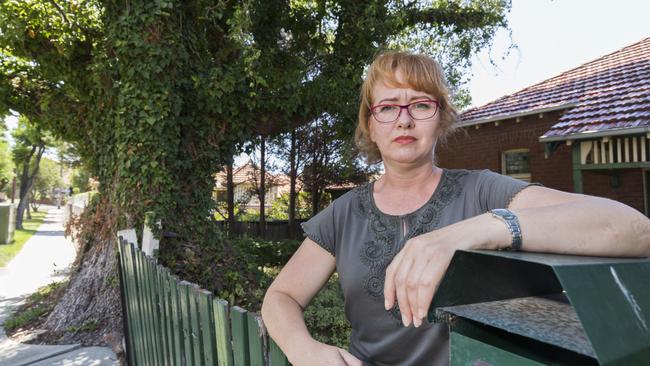 Haberfield resident Linda Viskovic says the tree is a safety risk. Photo: Matthew Vasilescu