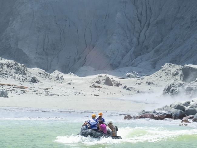 First responders to the White Island incident bring back people affected. Picture: @sch/Michael Schade on Twitter