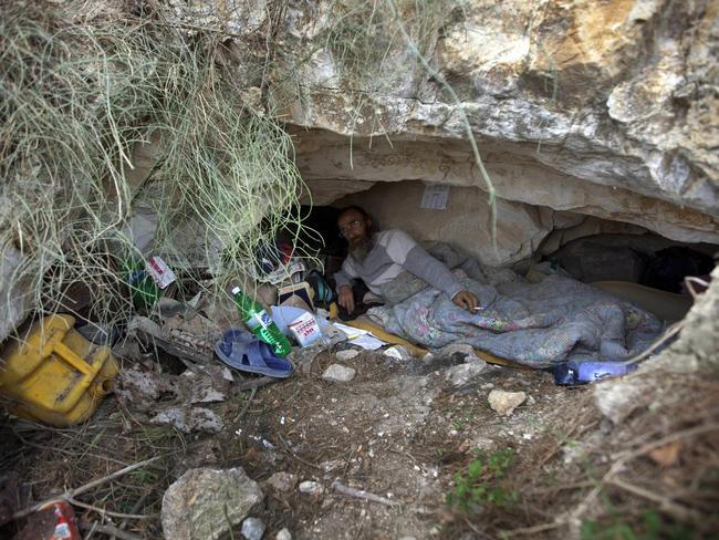 Vlademir Carpin, a Russian Christian pilgrim, lies in a cave in the Mount of Olives. Carpin says he decided to live there to await the return of the Messiah. Picture: AFP