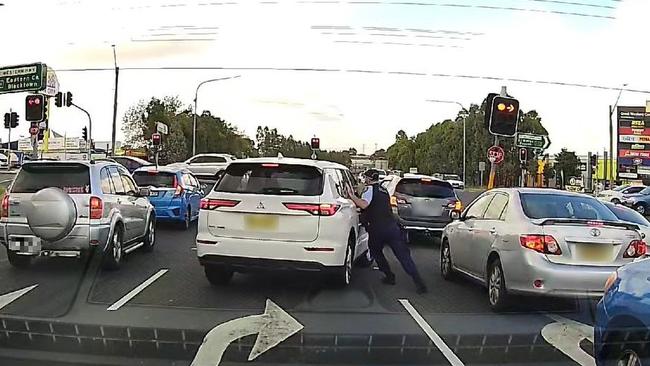 The moment the first officer reaches the car.