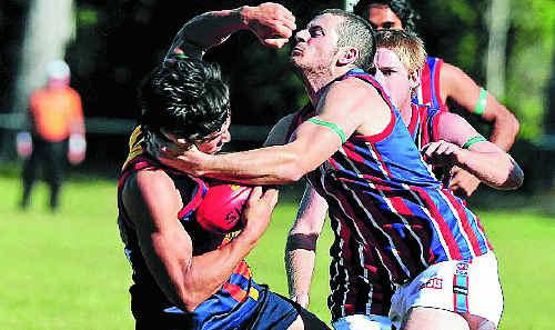 The Noosa Tigers’ Todd Panoho is collared by a Wilston Grange defender at Weyba Road last month. Picture: Geoff Potter