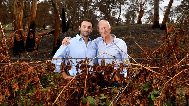 Tomich winemakers Jack Tomich 21, and his grandfather Dr John Tomich at their family’s Woodside winery, which was ravaged by the Cudlee Creek fires in December. Picture: Tricia Watkinson