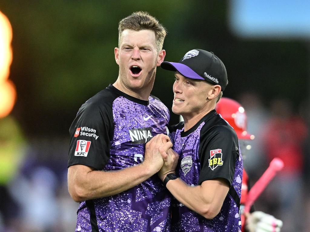 Mitch Owen and Nathan Ellis of the Hurricanes celebrate a wicket against the Renegades. (Photo by Steve Bell/Getty Images)