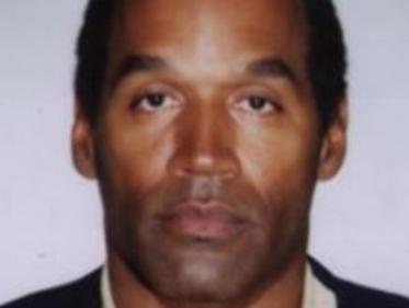 OJ Simpson in his booking photo mug shot for the murders of Nicole Brown and Ron Goldman