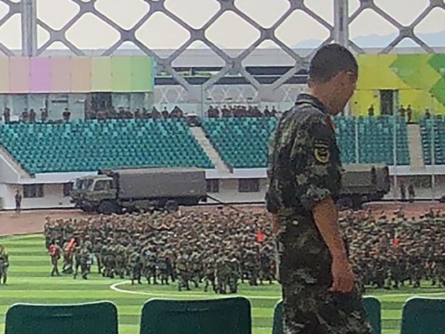 Chinese military personnel gather at the Shenzhen Bay stadium in Shenzhen, bordering Hong Kong, for drills which raised fears of military intervention in Hong Kong. Picture: AFP