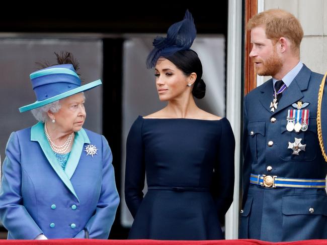 Queen Elizabeth, Meghan, Duchess of Sussex and Prince Harry, Duke of Sussex on the balcony of Buckingham Palace. Picture: Max Mumby/Indigo/Getty Images