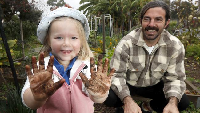 University of Adelaide PhD candidate Jacob Mills with Abi (3) in the Fern Ave Community Garden. Research showing revegetation can restore the natural diversity of soil microbes, with potential human health benefits. Photo Kelly Barnes