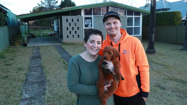 ‘Our interest rate has come down’: Hannah Lennon-Mather, Brodie Veness and Rufus at their new home in Elderslie, in Sydney’s southwest. Picture: John Feder