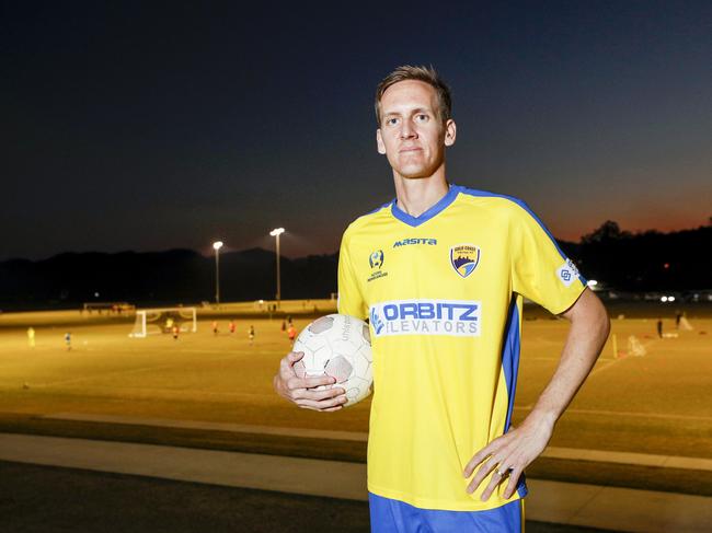 Gold Coast United's Rufus Scott, 13 with former Socceroo Michael Thwaite. Pic Tim Marsden