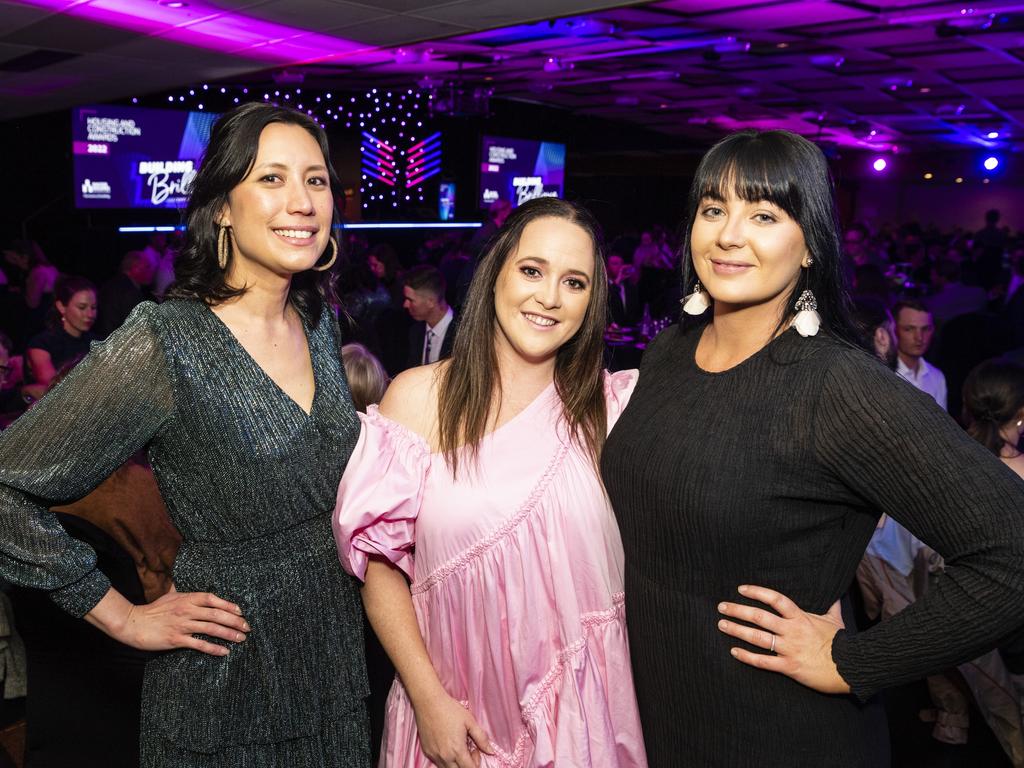 At the Downs and Western Housing and Construction Awards are (from left) Ishbel Macauley, Tarla Judd and Megan McGuinness of Hutchinson Builders at Rumours International, Friday, July 22, 2022. Picture: Kevin Farmer