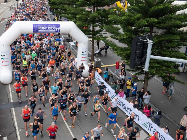 Melbourne’s CBD buzzes as runners take off. Picture: Tony Gough