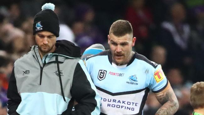 Cronulla’s Josh Dugan leaves the field injured.