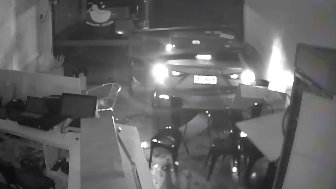 A stolen Mazda 3 reverses into the front of Chilli Mama Take Away in Whitfield on Monday night. Picture: Supplied