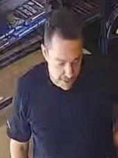 One of two men police believe may be able to assist them with their investigation into the alleged fraudulent use of a credit card.