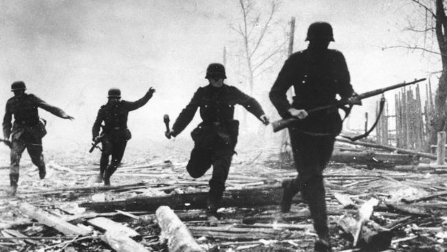 Confronting topic … children are often fascinated by WWII. This 1941 picture shows German soldiers advancing against Red Army positions in the Soviet Union.