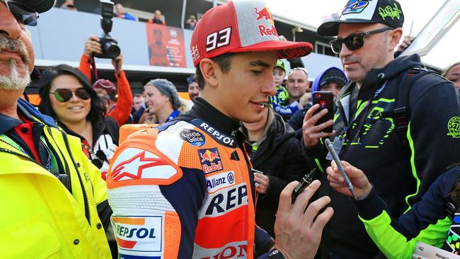 Marc Marquez signs autographs at Phillip Island after qualifying. Picture: Mark Stewart